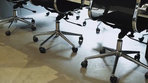 Empty Office Chairs in Trendy Millennial Office Space Closeup Shot of Office Chairs on Wheels Camera
