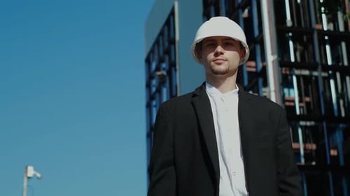 Construction Worker Gives Thumbs Up and Okay Sign