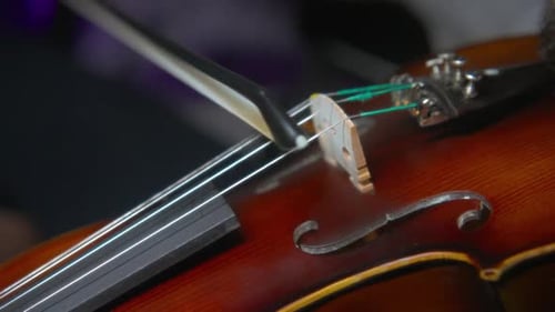 Close Up of Brown Violin Being Played