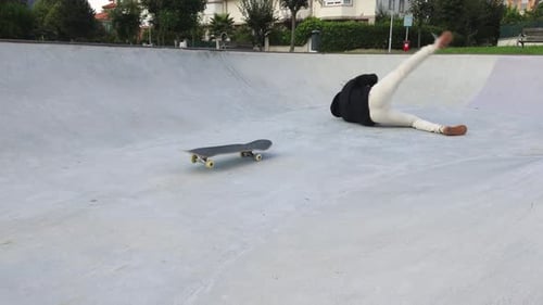 A Skater Falls Off His Board While Practicing at the Skate park, 4k slow motion
