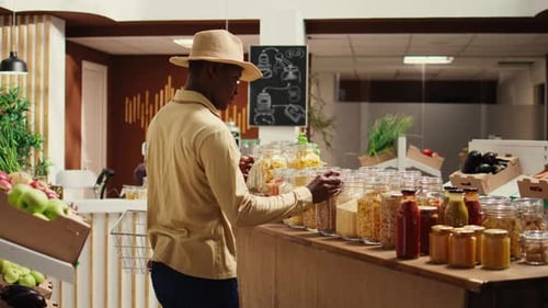 Client Examines Cereals and Grains at Zero Waste Eco Store