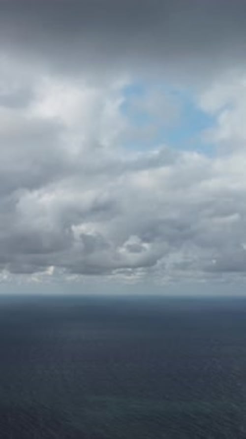 Aerial Vertical View Dramatic Moody and Gloomy Rain Clouds Over Sea Abstract Aerial Nature Summer