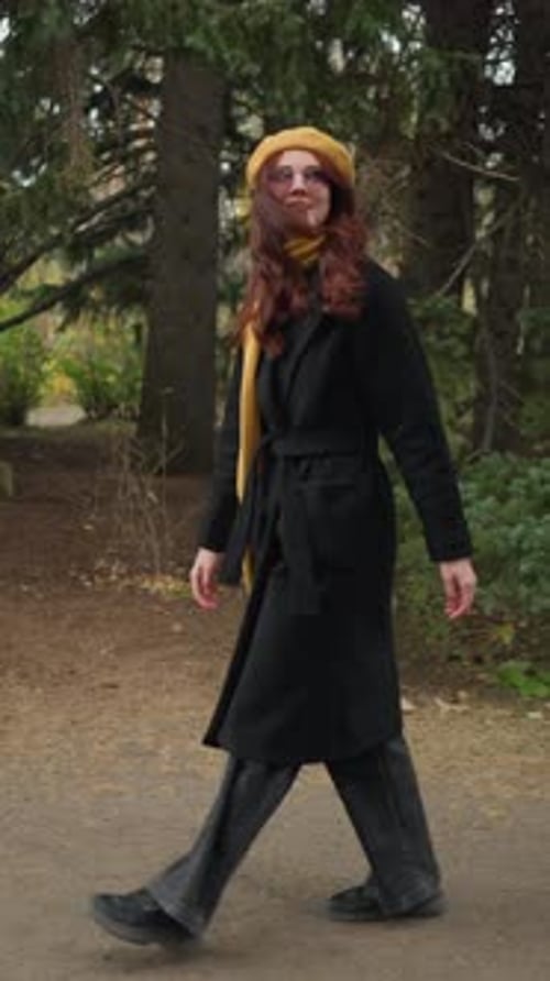 Joyful Autumn Walk Tourist with Yellow Beret in Lush Park