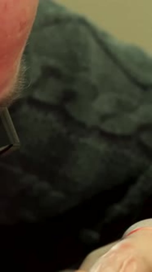 Skilled Watchmaker Meticulously Examines Intricate Watch Mechanism