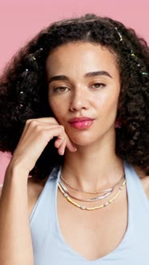 Beauty, shine and face of woman in studio for salon, self care and makeup