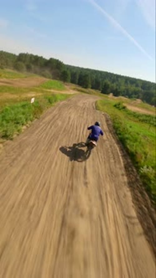 Motorcycle Rider on Dirt Track Aerial View