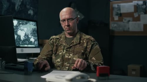 Portrait of Caucasian Military Officer Working with Contracts in Command Hub