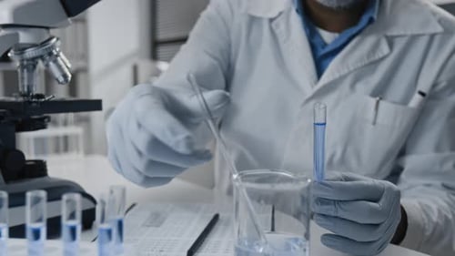 Scientist Working in a Lab with Test Tubes