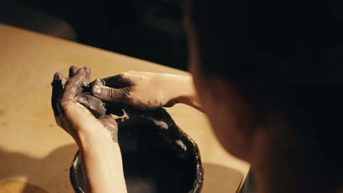 Woman Potter Works with Clay on Master Class in Studio Working Process in Ceramic Workshop Potter