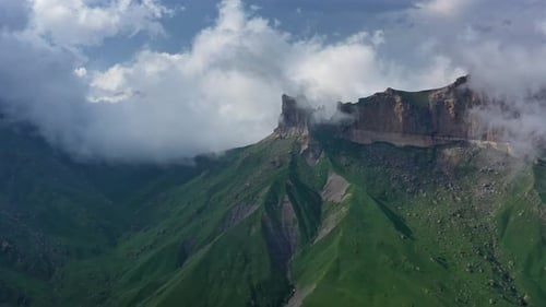 Aerial View of Mountains with Green Grass and Clouds