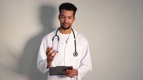 Young Adult Medical Professional Taking Notes