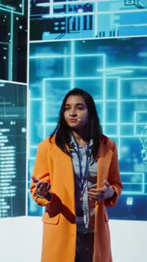Vertical Video Woman Uses Microphone to Talk at AI Convention with Business Investors