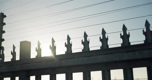 Fence, powerlines and electricity or industrial voltage or gate as protection safety or energy