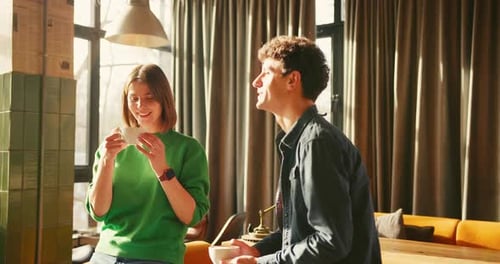 Young Couple Enjoying Coffee and Conversation in Stylish Cafe