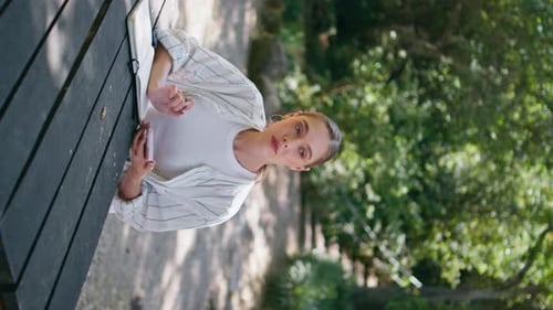 Attractive Freelancer Working Forest Table with Notepad Lady Surfing Vertical