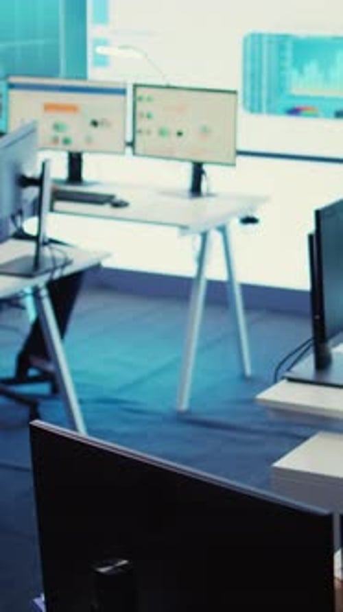 Vertical Video Marketing Specialist Studying Infographics on Computer in a Monitoring Room