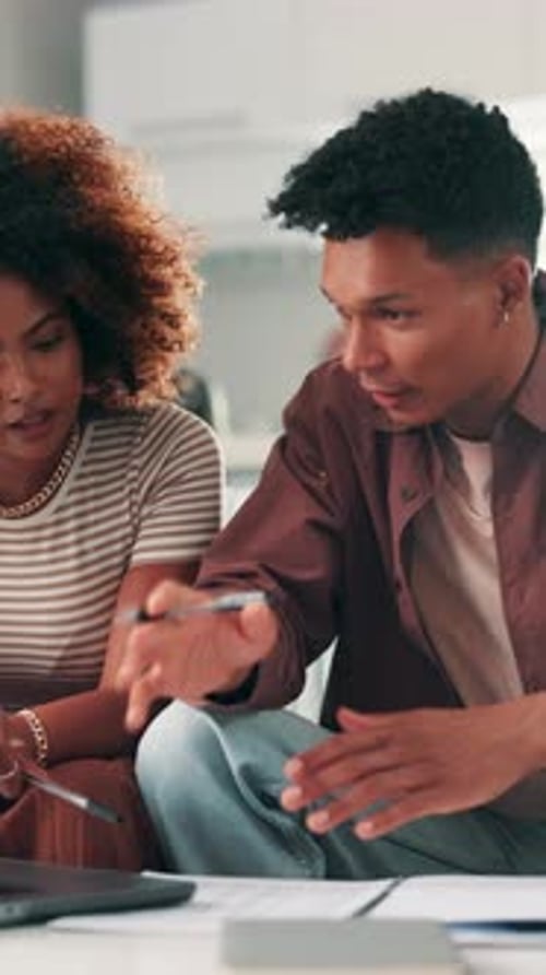 Young Adults Working on Documents at Home