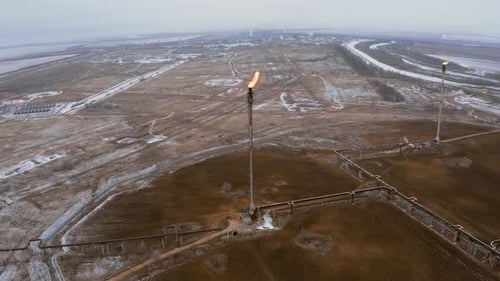 Burning torch at the gas plant. Aerial view of a lit candle