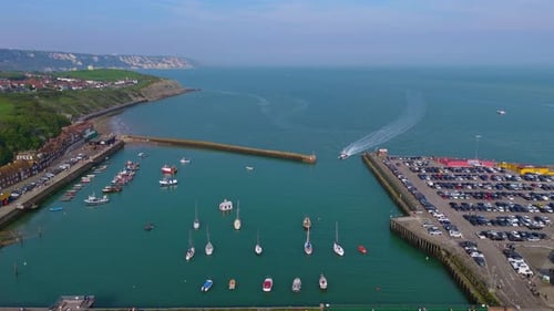 Folkestone pier hums with joy as seagulls soar above seaside crowds