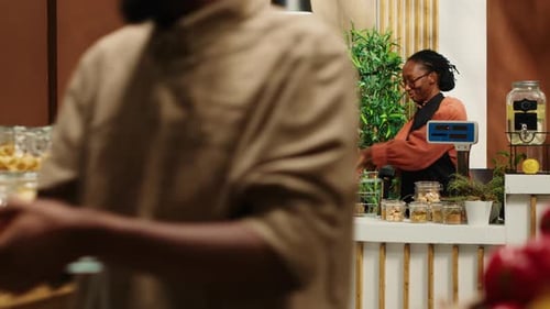 Local Vendor Weighting Fresh Produce for Customer at Farmers Market
