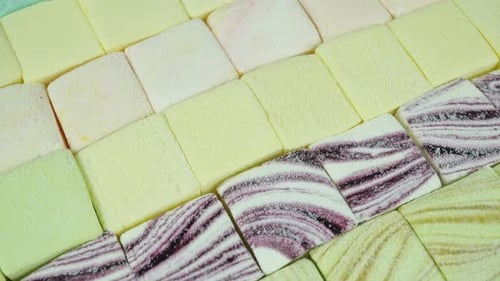 Rotating Colored Classic Marshmallows Closeup.