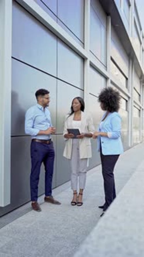 multiethnic Business partners shaking hands after a successful meeting outside office building