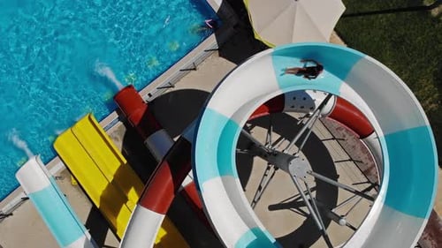 drone view of people swimming in aquapark and pool