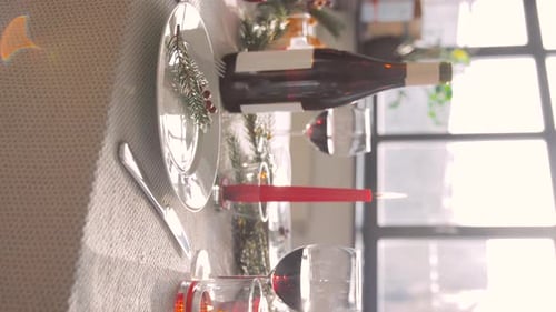 Festive Table Setting with Candles and Wine