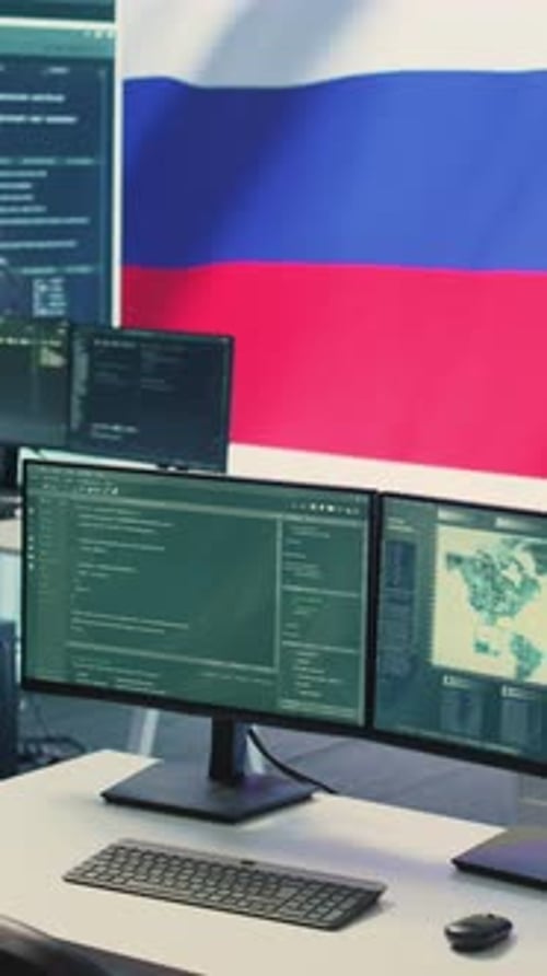 Cybersecurity Center with Monitors and Russian Flag