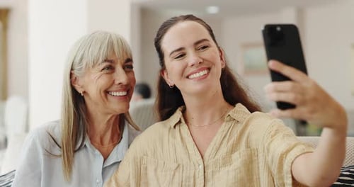 Cheerful Women Taking Smartphone Selfie Indoors