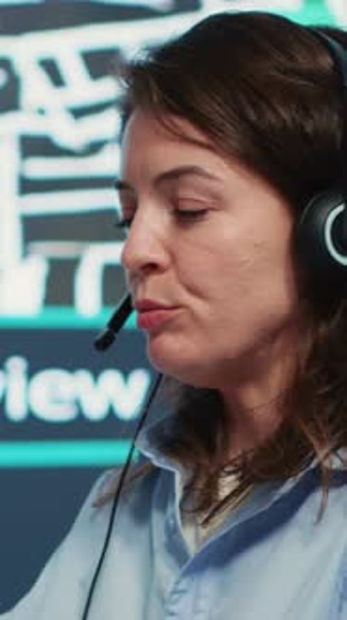 Vertical Video Call Center Employee Communicating Alternative Routes for Couriers