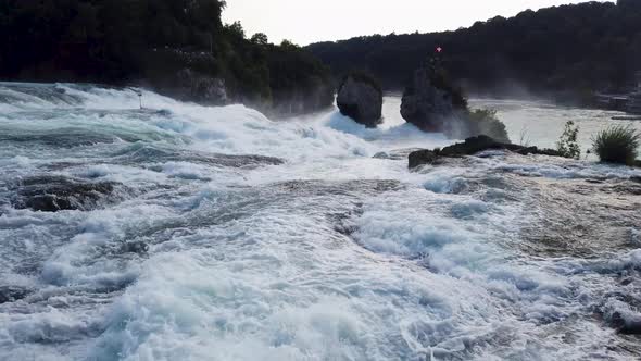 Fast flowing wide river with white water, top of the waterfall ...