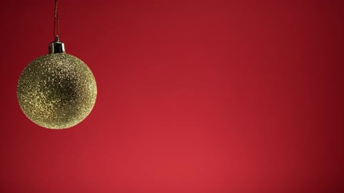 Festive Gold Ornament on a Red Background