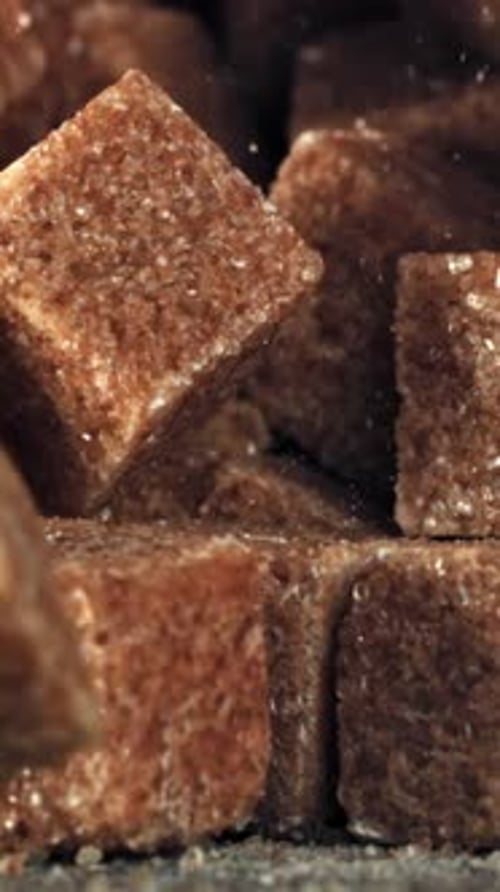 Cane Sugar Cubes Fall on the Table Filmed on a Highspeed Camera at 1000 Fps