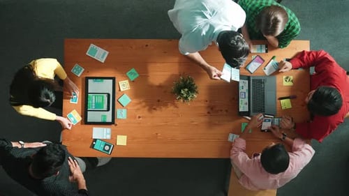 Programmer team brainstorm and plan Ux Ui design for mobile phone. Convocation.