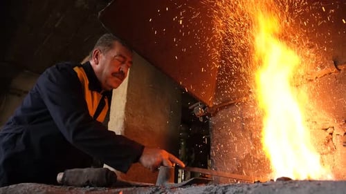 Man Working In Forge Workshop 2