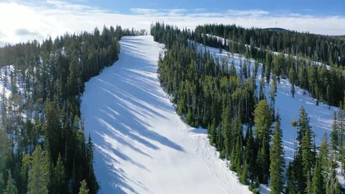 Aerial View of Snowy Mountain Ski Resort in Winter