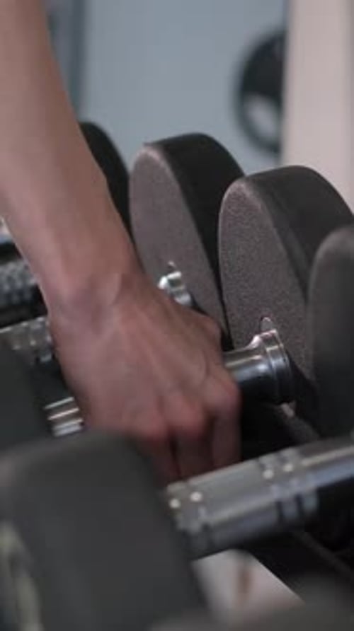 Closeup of Dumbbells in a Modern Gym Vertical Video