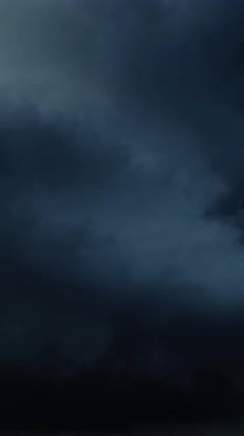 Storm Clouds Rolling with Flashes of Lightning