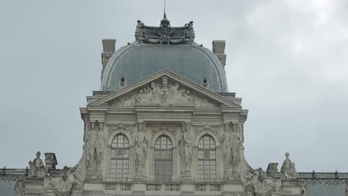 Low angle view of a gorgeous building with round shaped roof and statues