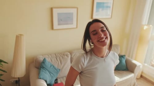 Woman Enjoying Music and Dancing at Home