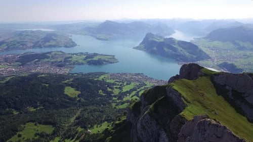 A Stunningly Breathtaking Aerial View Showcasing an Expansive Lake Surrounded By Majestic Mountains