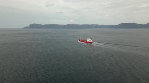 Empty Cargo Ship closing in on Norway's Most Dangerous Waters; Stadthavet. Aerial drone video follow