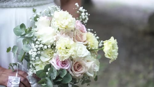 Close Up of Woman Holding Wedding Bouquet