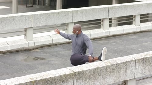 Man Stretching Leg on Bridge, Urban Fitness