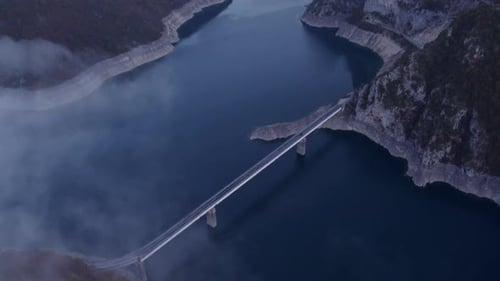 Aerial view of misty Piva Lake and mountains, Montenegro.