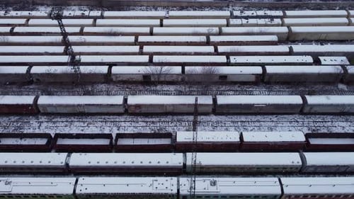 Aerial View of Snow-Covered Train Cars in Winter