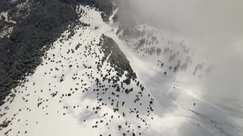 Snowy Mountains and Clouds Aerial View