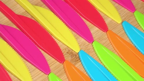 Close Up of Colorful Serrated Plastic Knives