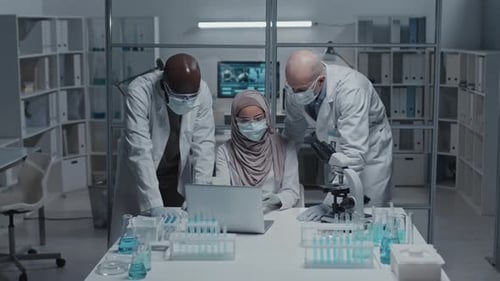 Scientists in Masks Working Together